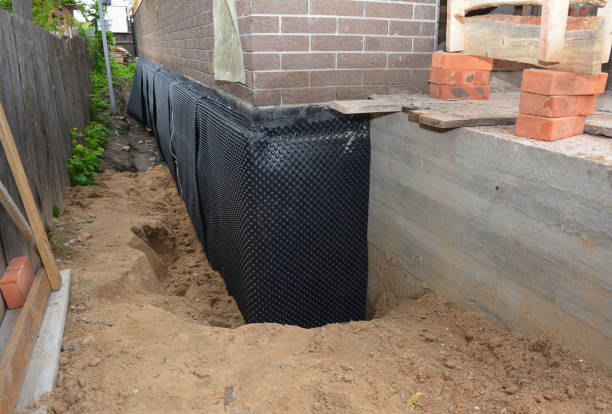 Happy homeowners after waterproofing job in Scipio Center